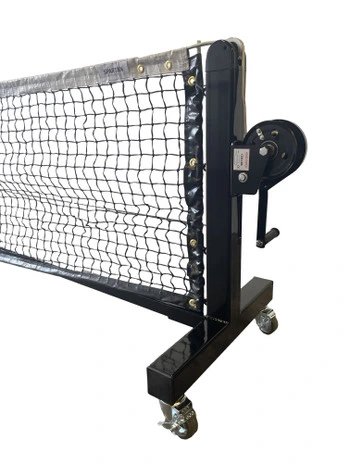 Spartan portable pickleball net on wheel on blue pickleball court