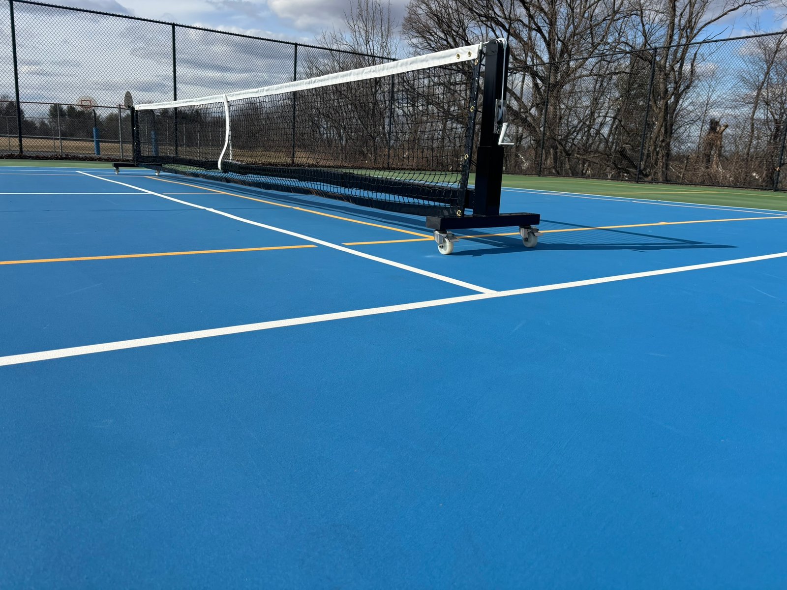 Pro Heavy Duty Portable Pickleball Net | Optional Wheels 7 Portable pickleball net on wheels showing rigid frame design that requires no center support rod.